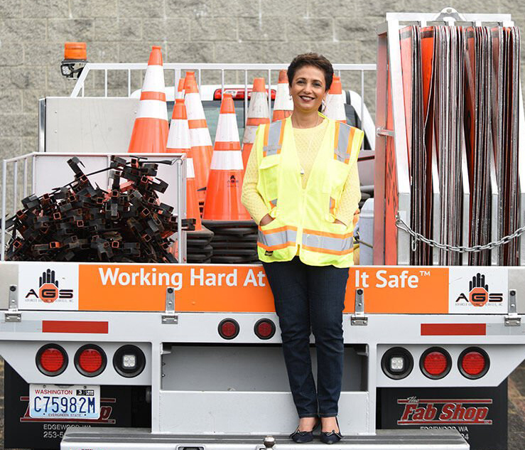 Image of Arti O'Brien Standing on Back of Truck