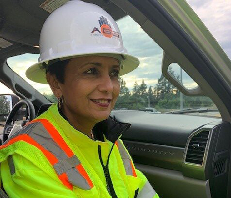 Image of Arti O'Brien sitting in truck with hard hat on.