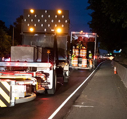 traffic control trucks unloading traffic control equipment