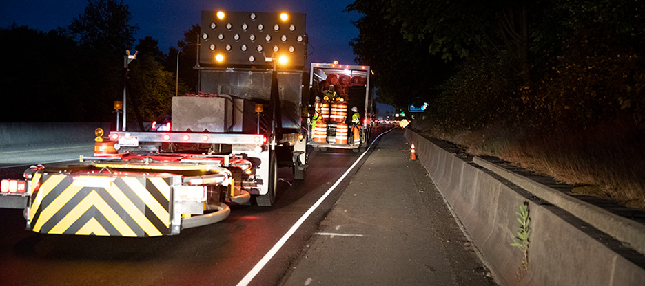 traffic control trucks unloading traffic control equipment