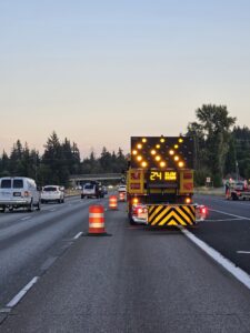 an arrow board, delineators, and attenuator facilitating a lane closure